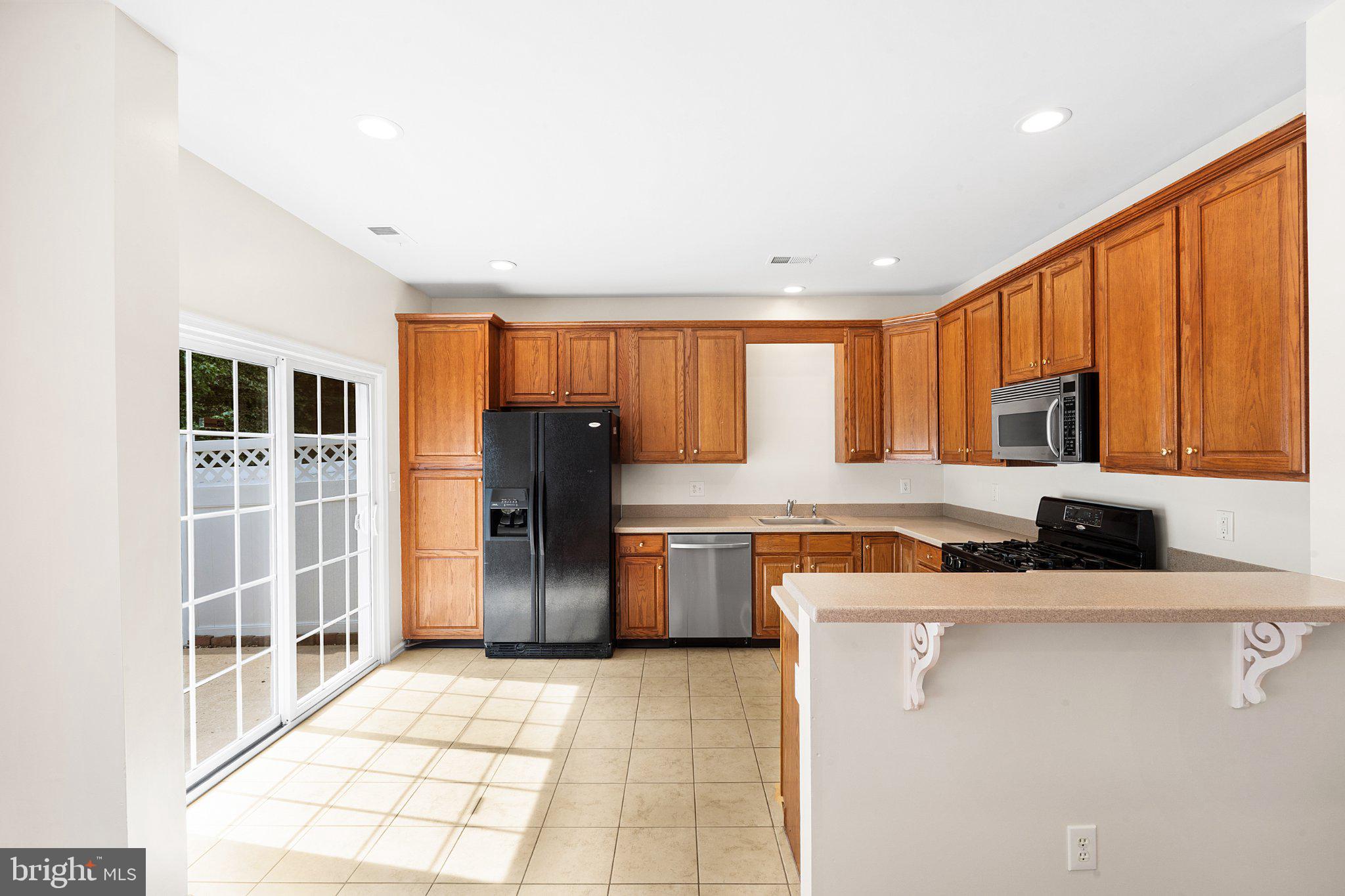 99 Warwick Road Princeton Junction, NJ 08550 - Photo 9 of 35 Bright kitchen with warm wood accents.