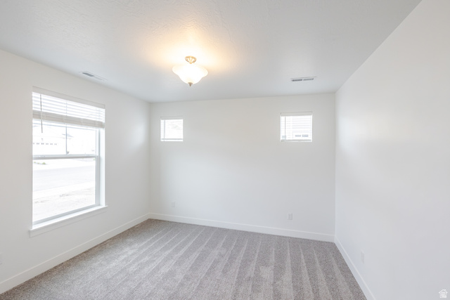 693 West 4500th South, Unit O101 Mapleton, UT 84664 - Photo 10 of 16 Empty room featuring baseboards and light carpet
