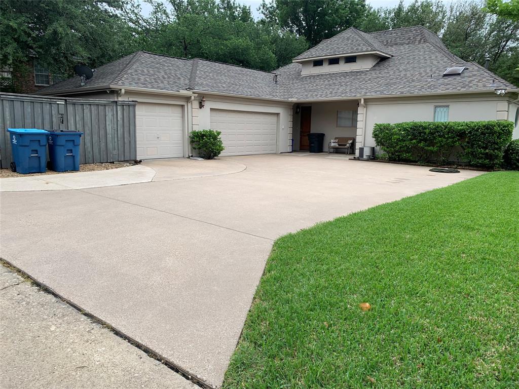 1450 Meandering Way Rockwall, TX 75087 - Photo 30 of 32 a front view of a house with a yard and garage