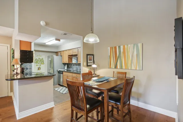 a dining room with furniture and window