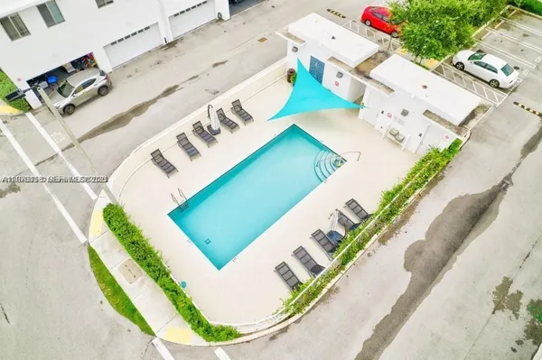 a view of a swimming pool with a patio