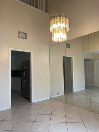a view of entryway with chandelier and window