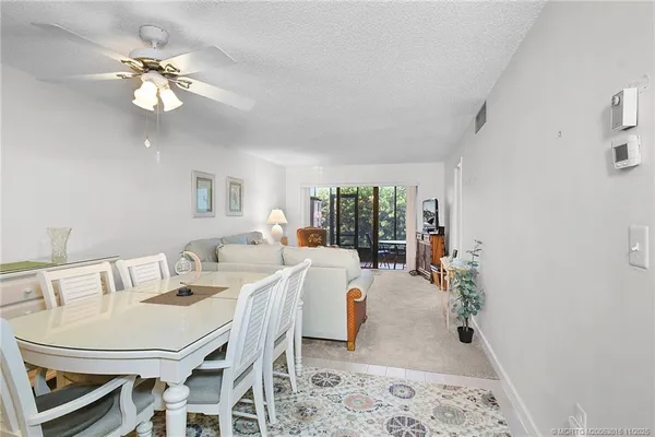 a very nice looking dining room with a table and chairs