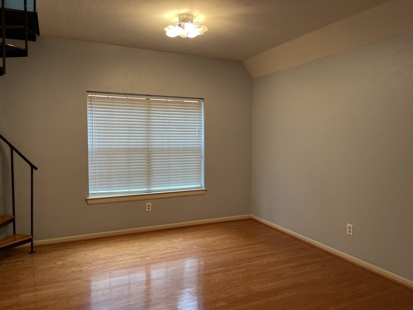 46 Sweetdream Place Spring, TX 77381 - Photo 13 of 18 an empty room with wooden floor and windows