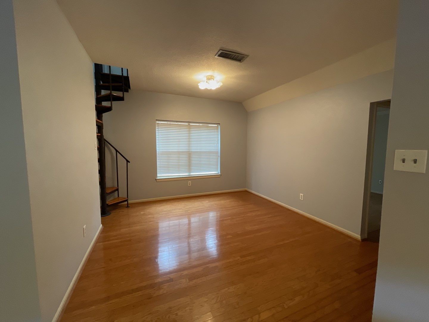 46 Sweetdream Place Spring, TX 77381 - Photo 5 of 18 an empty room with wooden floor and windows