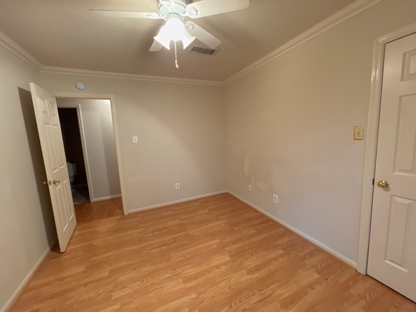 46 Sweetdream Place Spring, TX 77381 - Photo 10 of 18 an empty room with wooden floor and fan