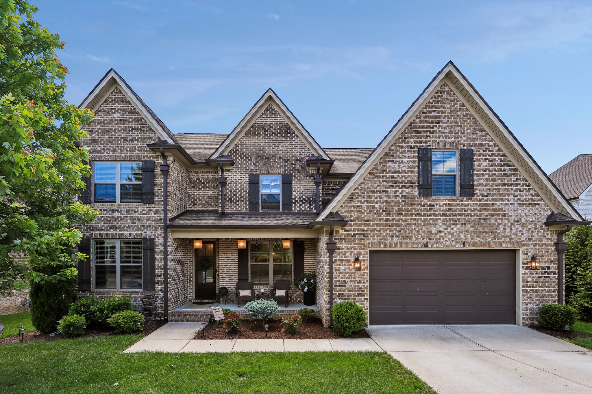 1006 Alpaca Drive Spring Hill, TN 37174 - Photo 1 of 32 a front view of a house with garden