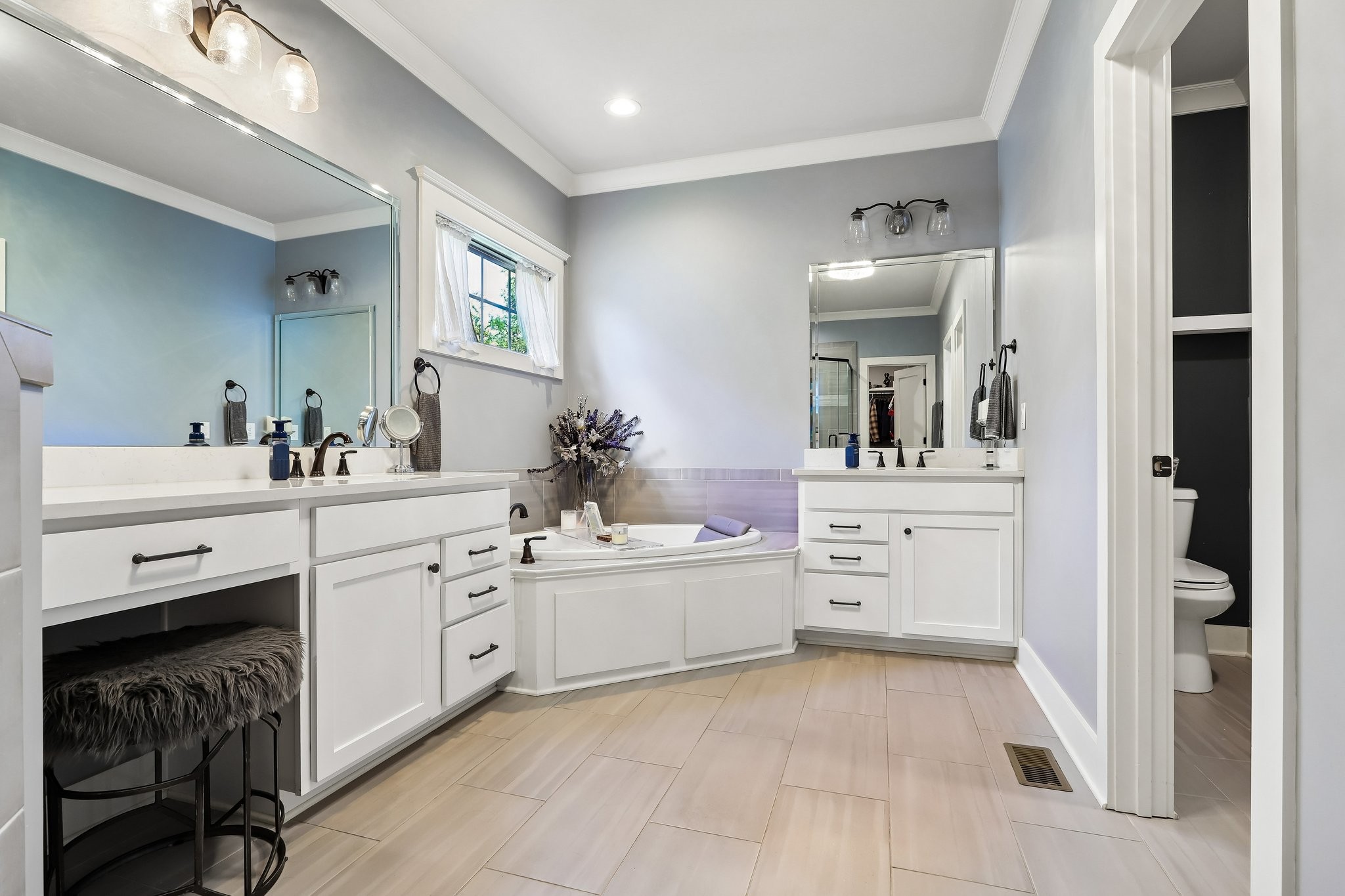 1006 Alpaca Drive Spring Hill, TN 37174 - Photo 12 of 32 a bathroom with a sink vanity and mirror