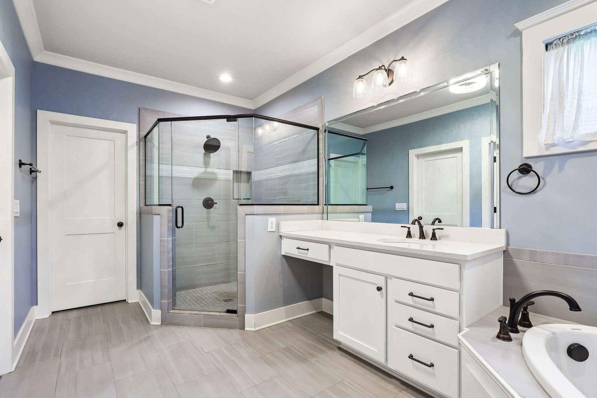 1006 Alpaca Drive Spring Hill, TN 37174 - Photo 13 of 32 a bathroom with a sink a toilet a mirror and shower