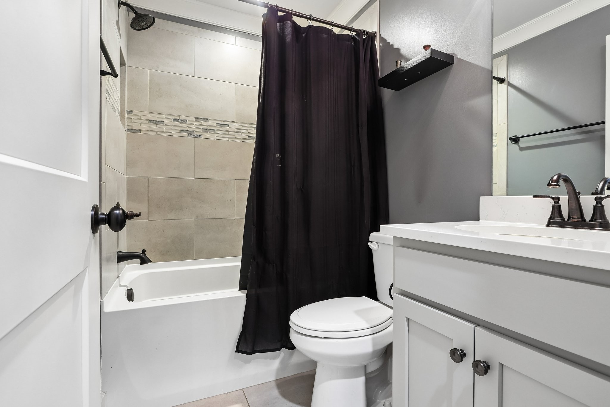 1006 Alpaca Drive Spring Hill, TN 37174 - Photo 15 of 32 a bathroom with a sink toilet and shower