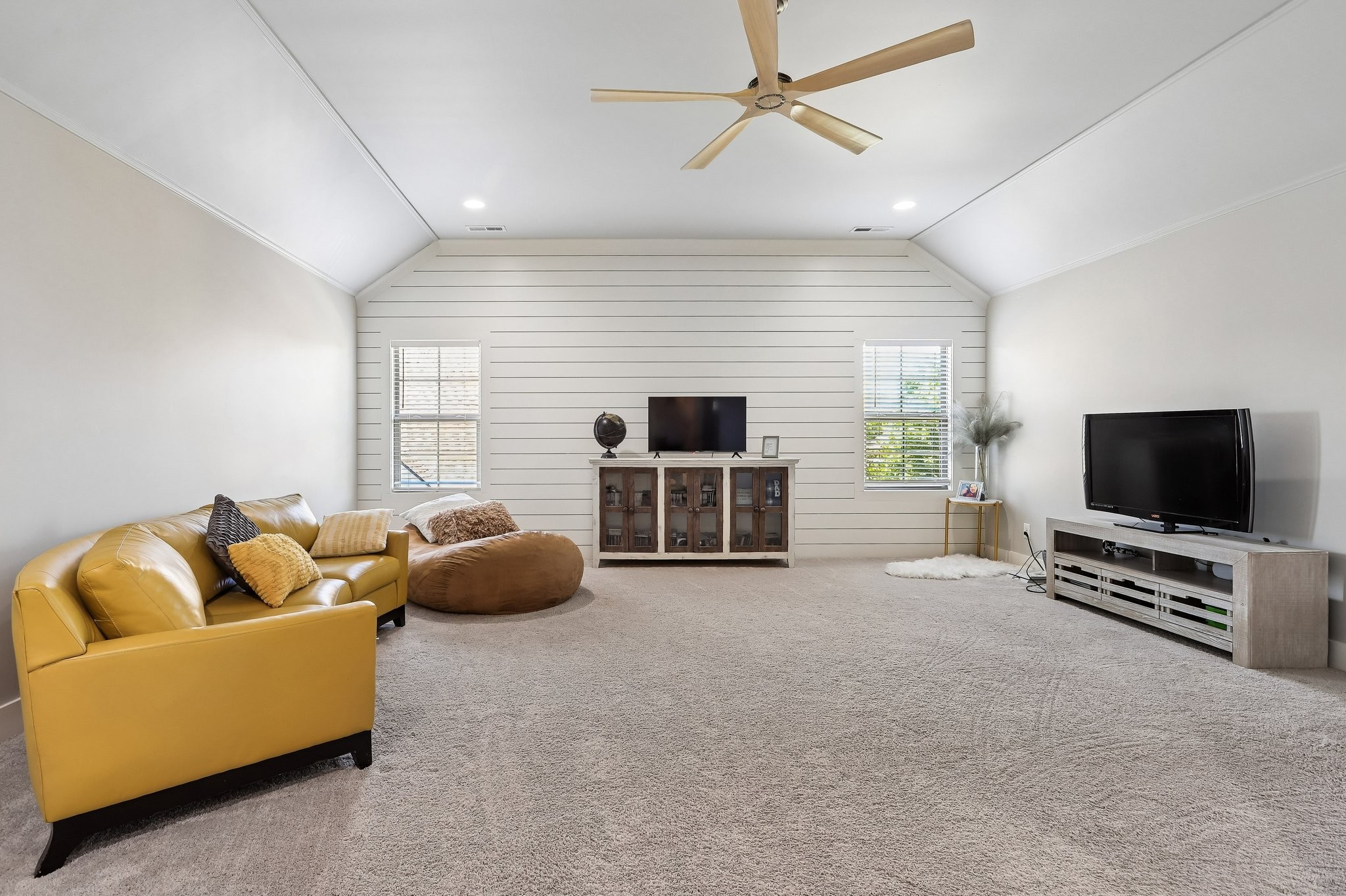 1006 Alpaca Drive Spring Hill, TN 37174 - Photo 17 of 32 a living room with furniture and a flat screen tv