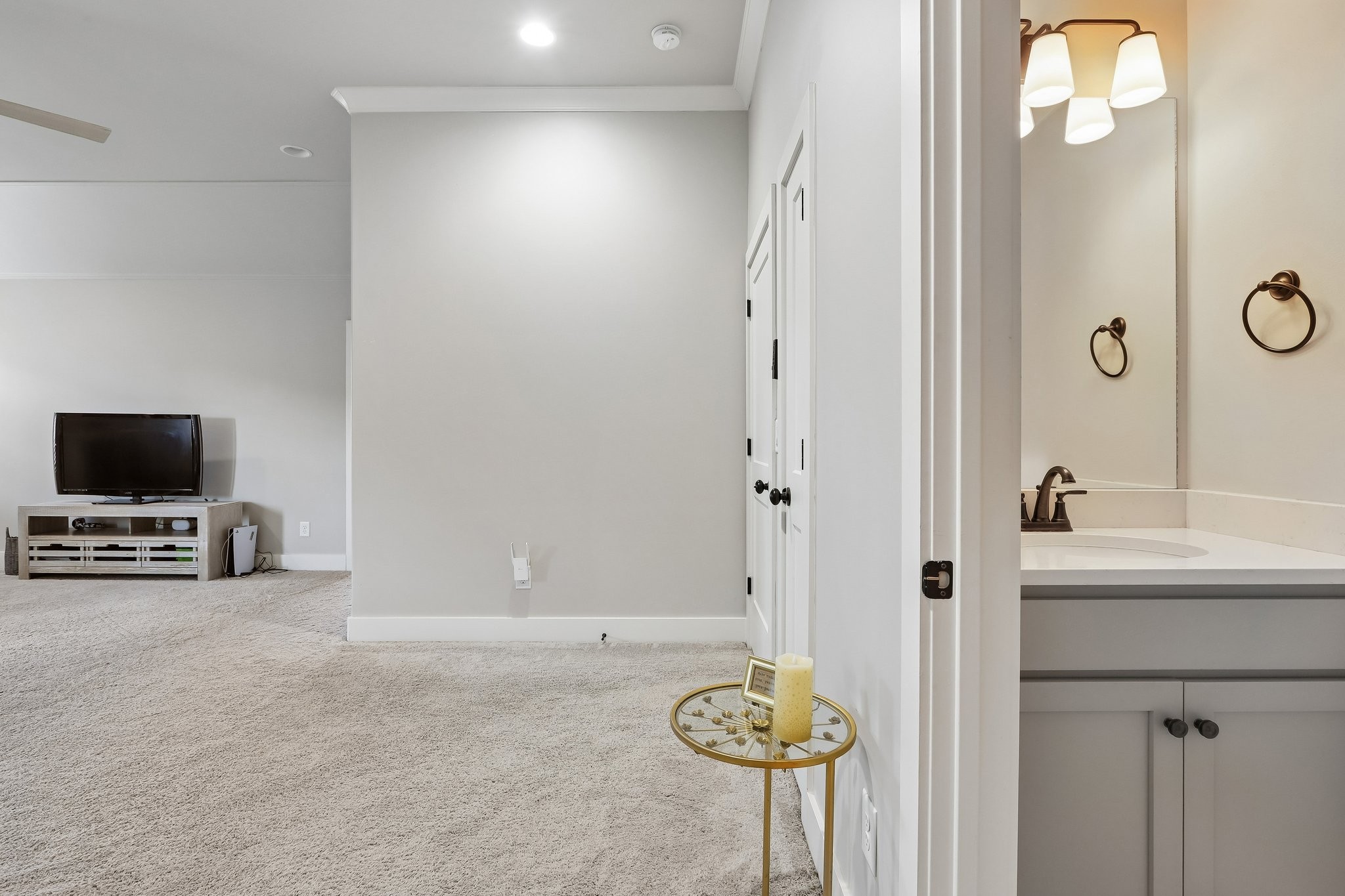 1006 Alpaca Drive Spring Hill, TN 37174 - Photo 21 of 32 a view of a room that has a bed and a flat screen tv