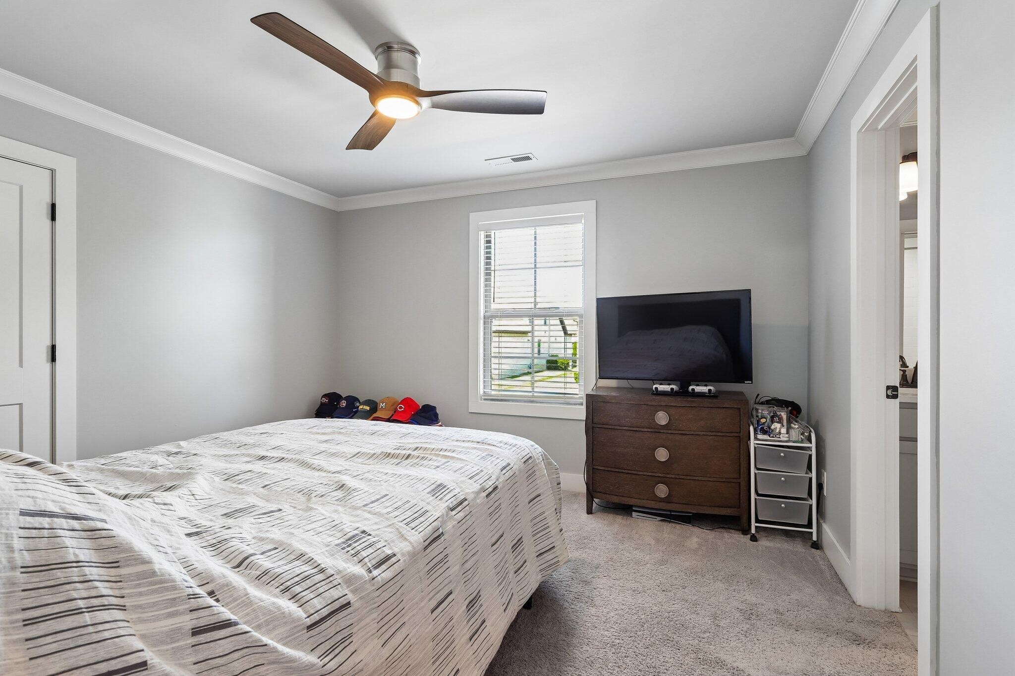 1006 Alpaca Drive Spring Hill, TN 37174 - Photo 25 of 32 a bedroom with a bed and a flat screen tv