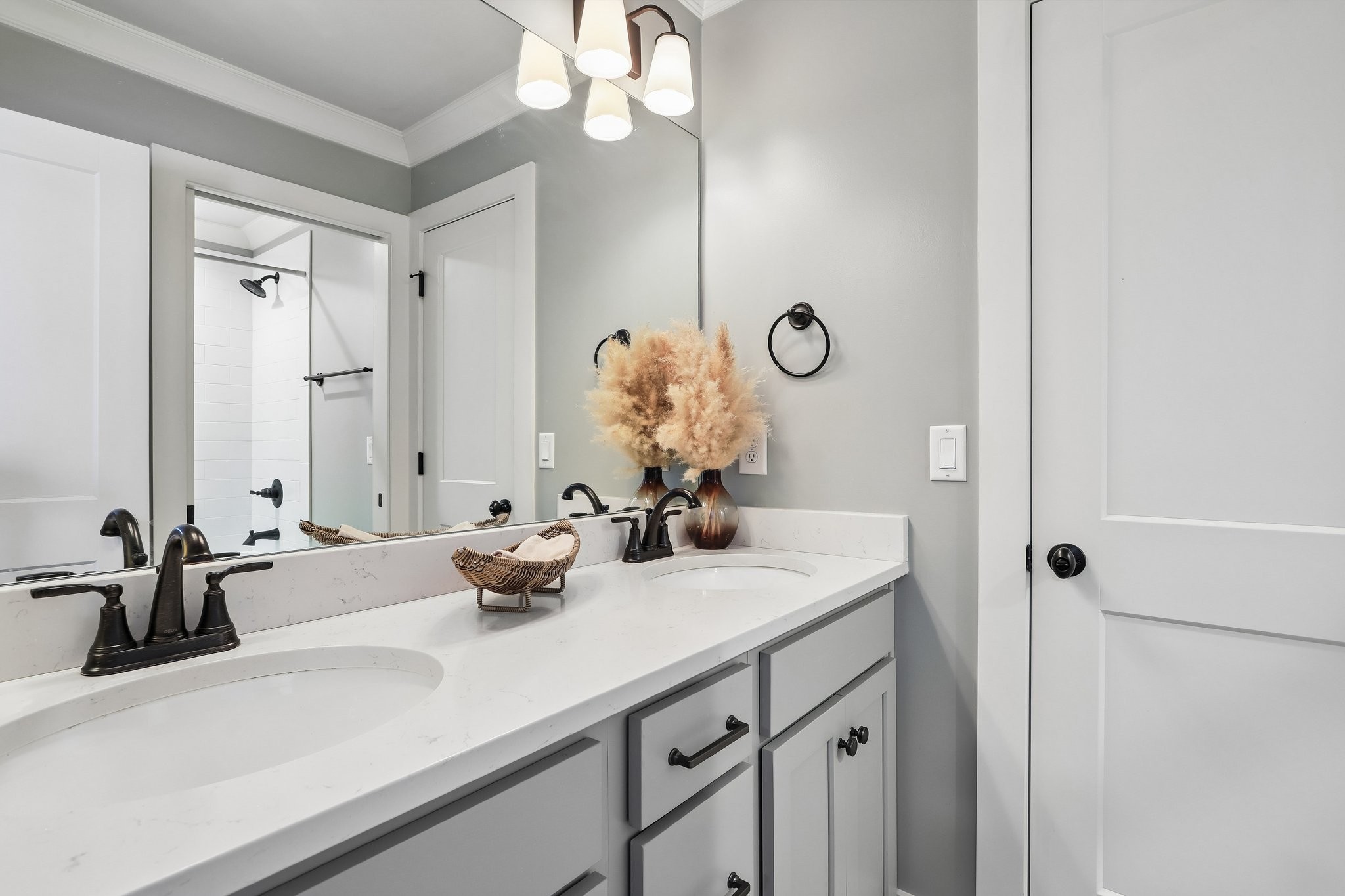 1006 Alpaca Drive Spring Hill, TN 37174 - Photo 29 of 32 a bathroom with a sink a large mirror and vanity