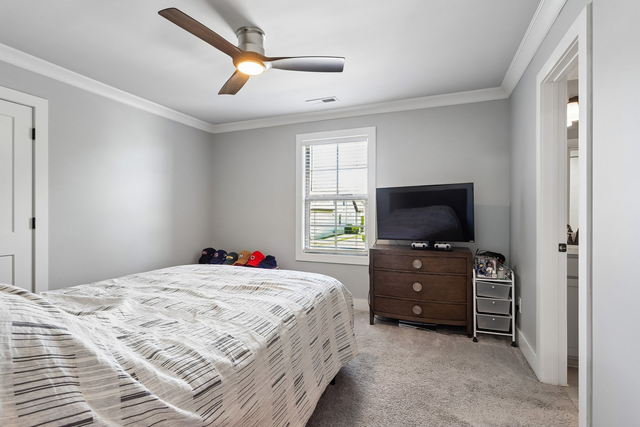 1006 Alpaca Drive Spring Hill, TN 37174 - Photo 30 of 32 a bedroom with a bed and a flat screen tv