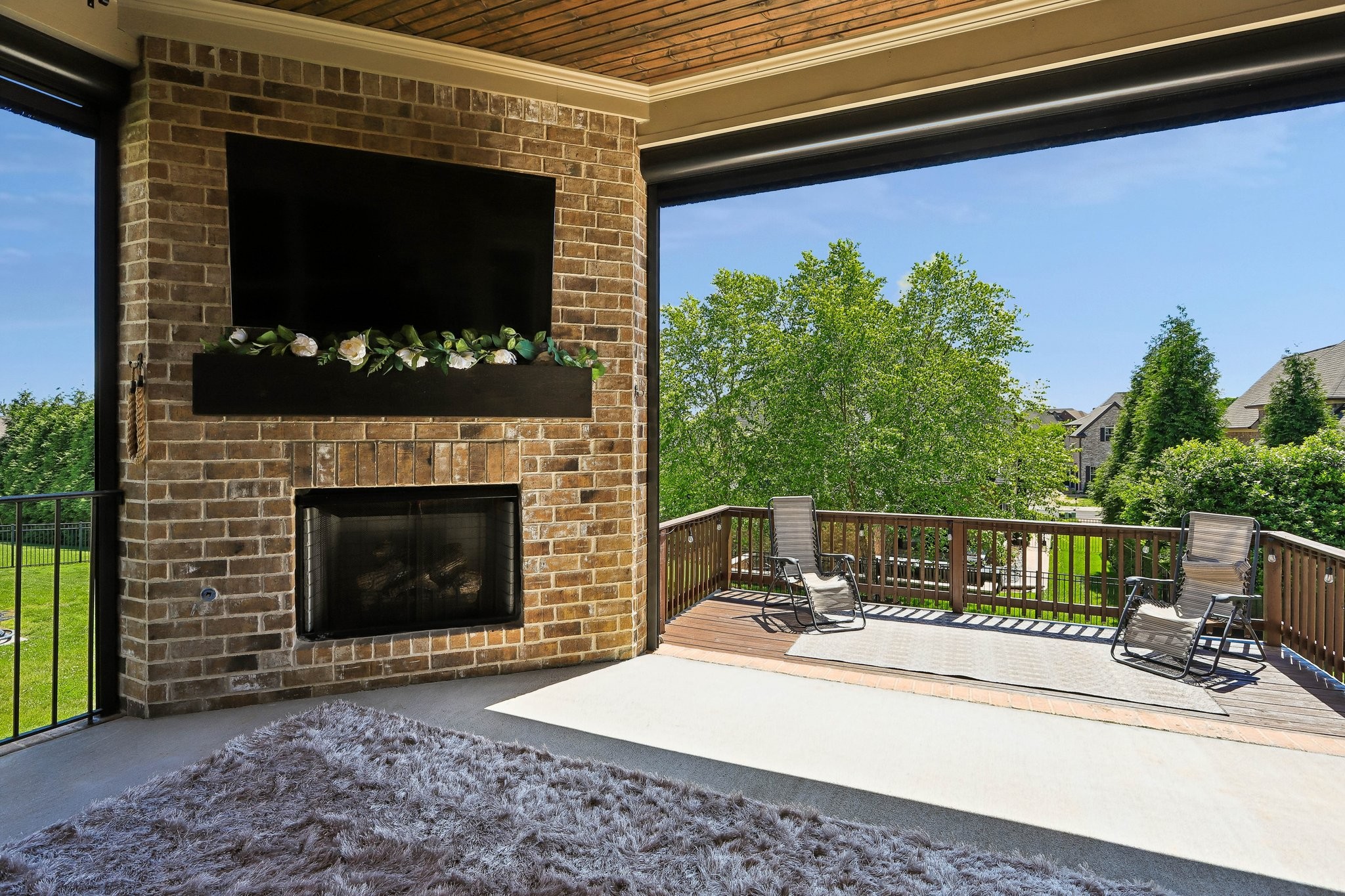 1006 Alpaca Drive Spring Hill, TN 37174 - Photo 31 of 32 a view of a patio with a table and a fire pit