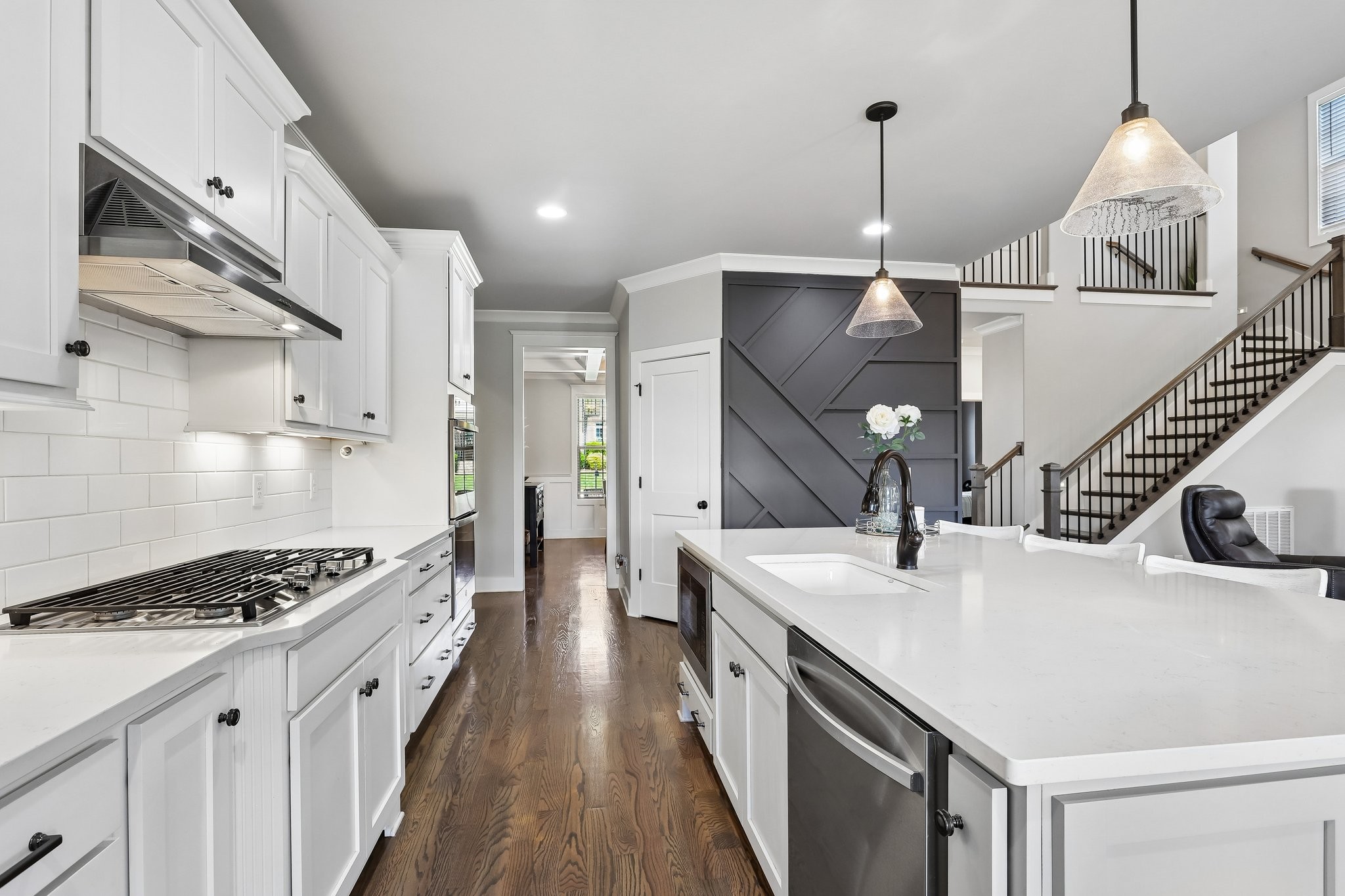1006 Alpaca Drive Spring Hill, TN 37174 - Photo 5 of 32 a kitchen with stainless steel appliances kitchen island a sink stove and cabinets