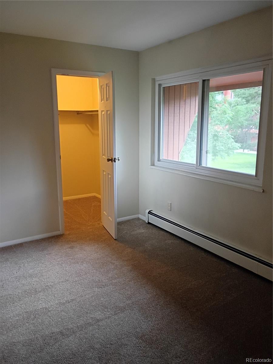 1625 West Elizabeth Street, Unit A1 Fort Collins, CO 80521 - Photo 14 of 27 an empty room with a window