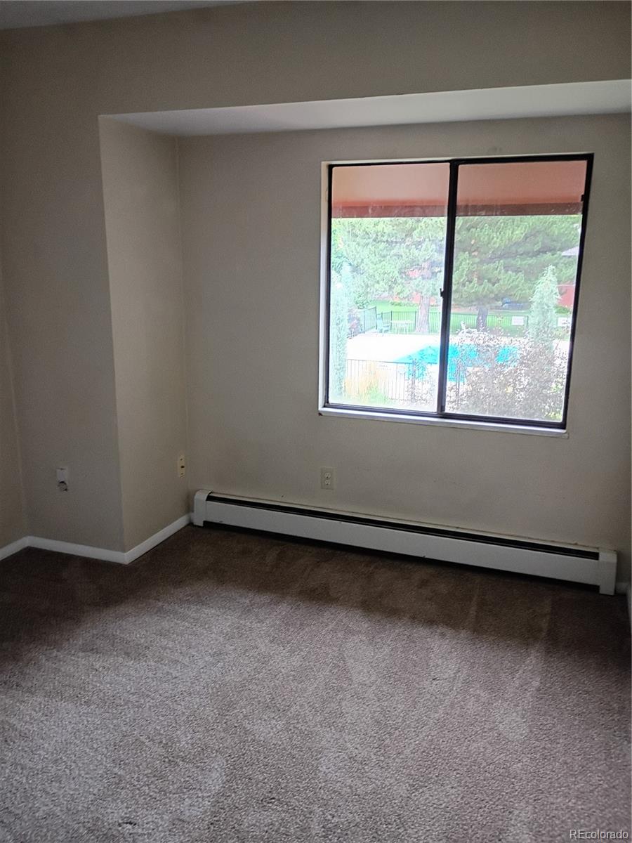 1625 West Elizabeth Street, Unit A1 Fort Collins, CO 80521 - Photo 15 of 27 an empty room with a window