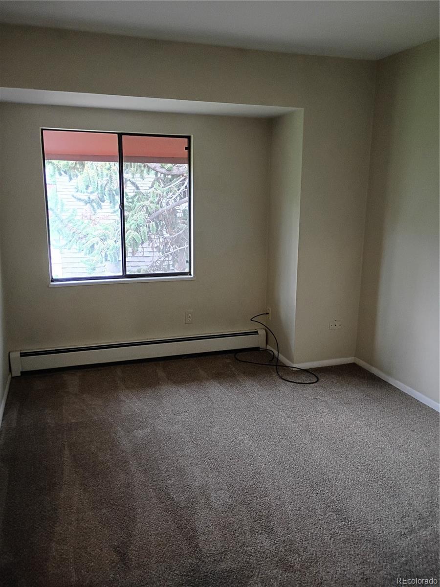 1625 West Elizabeth Street, Unit A1 Fort Collins, CO 80521 - Photo 16 of 27 an empty room with a window