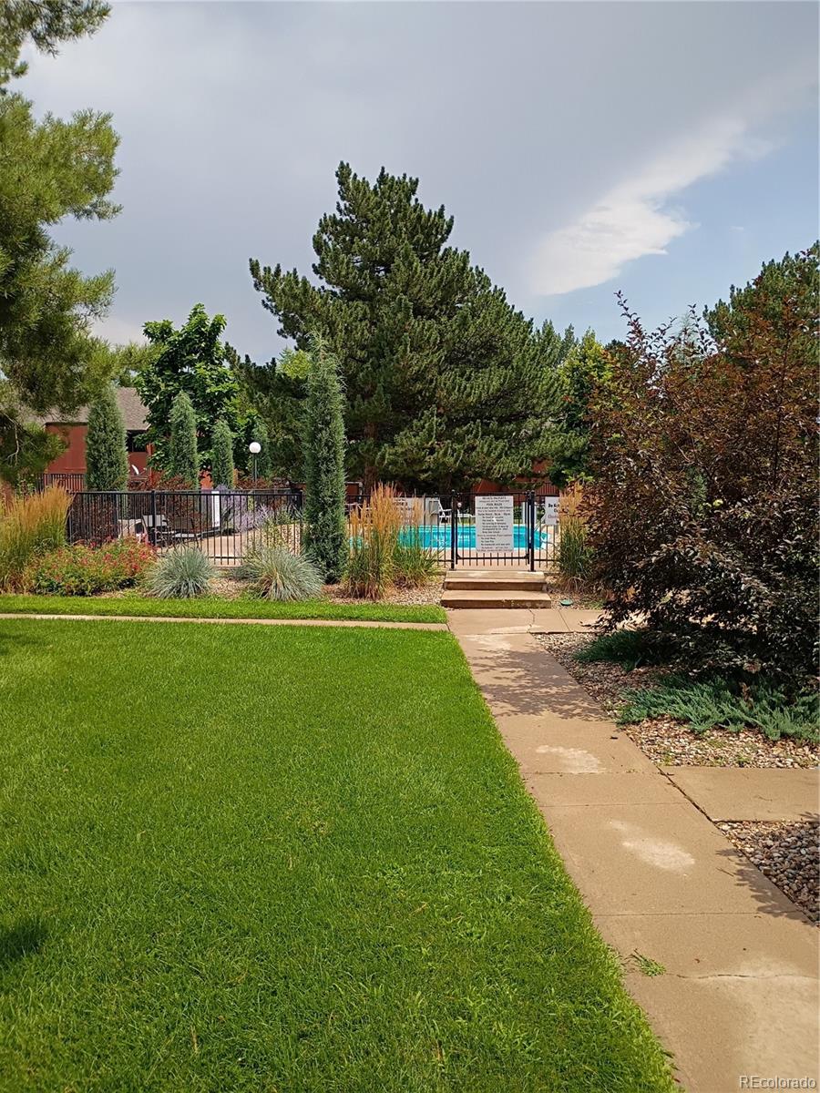 1625 West Elizabeth Street, Unit A1 Fort Collins, CO 80521 - Photo 18 of 27 a view of a house with a yard