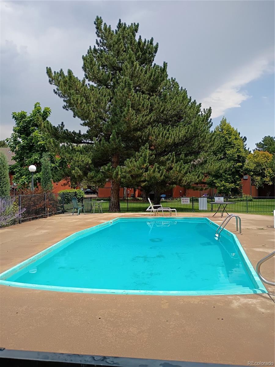 1625 West Elizabeth Street, Unit A1 Fort Collins, CO 80521 - Photo 19 of 27 a view of swimming pool with an outdoor space and seating area