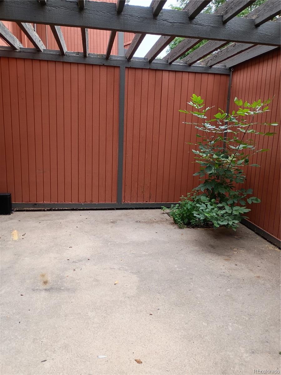 1625 West Elizabeth Street, Unit A1 Fort Collins, CO 80521 - Photo 23 of 27 a view of a room with a wooden fence