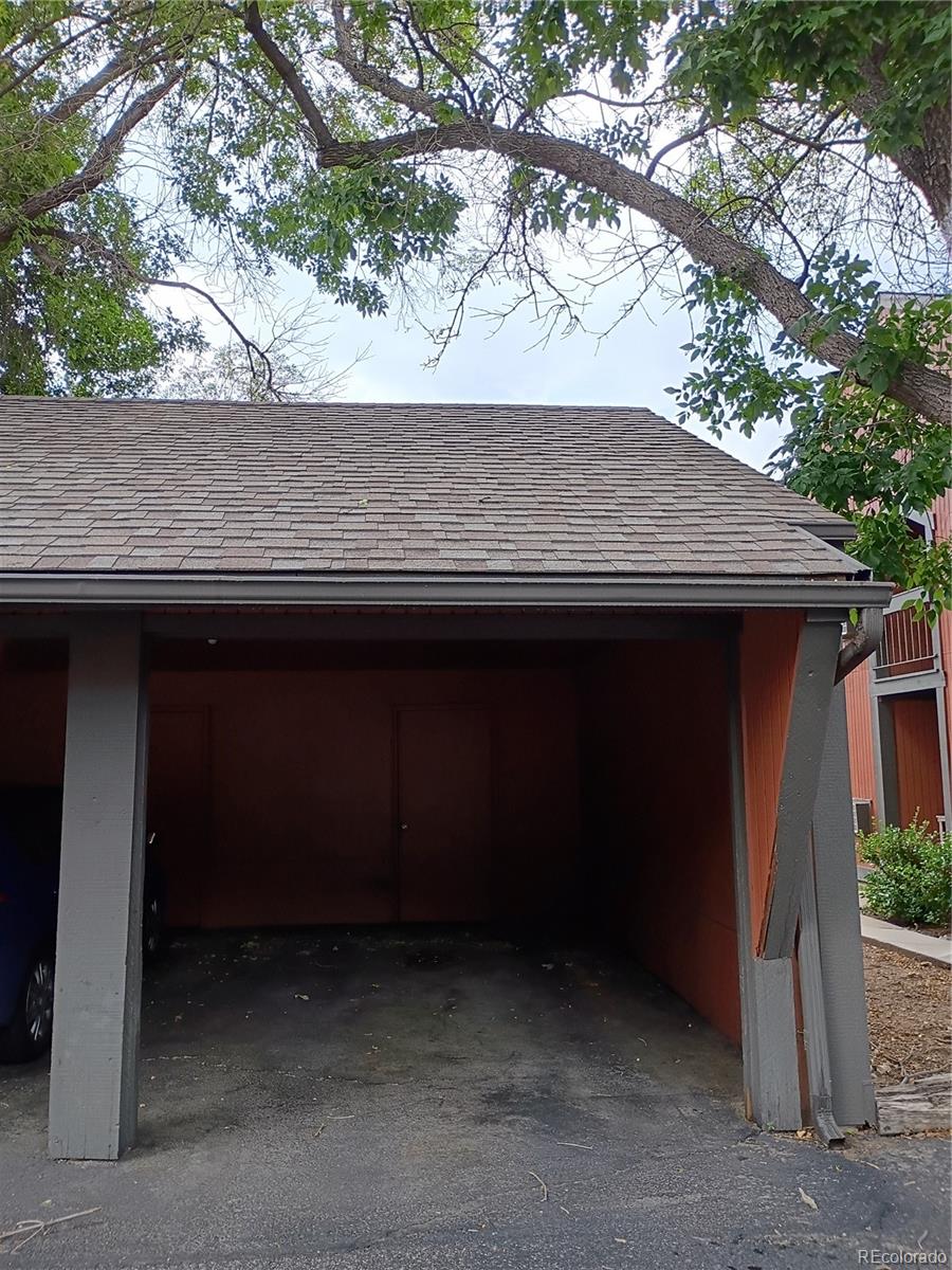1625 West Elizabeth Street, Unit A1 Fort Collins, CO 80521 - Photo 26 of 27 a backyard of a house with large trees