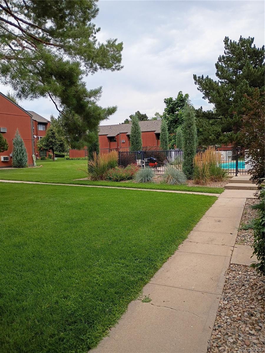 1625 West Elizabeth Street, Unit A1 Fort Collins, CO 80521 - Photo 9 of 27 a front view of a house with garden