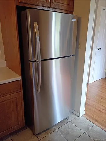 a kitchen with a sink and refrigerator
