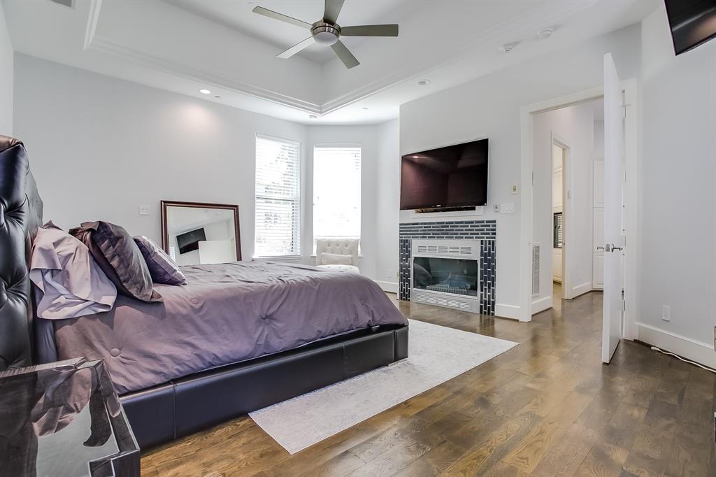6319 Turner Way Dallas, TX 75230 - Photo 15 of 40 a bedroom with a bed and a flat screen tv