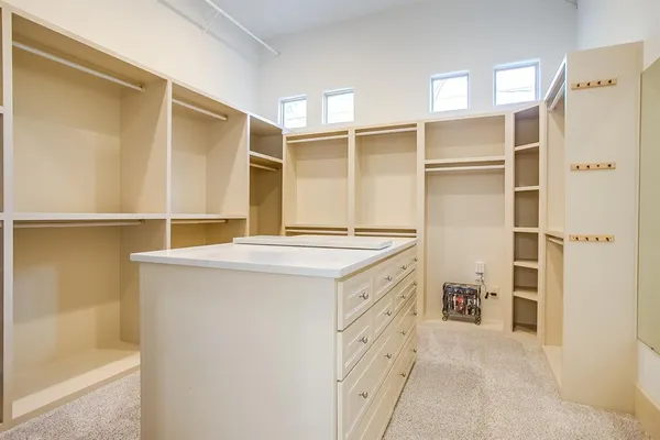 a kitchen with a refrigerator and a sink