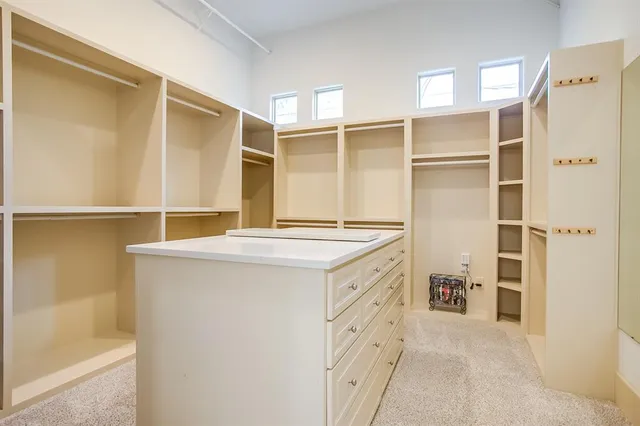 a kitchen with a refrigerator and a sink