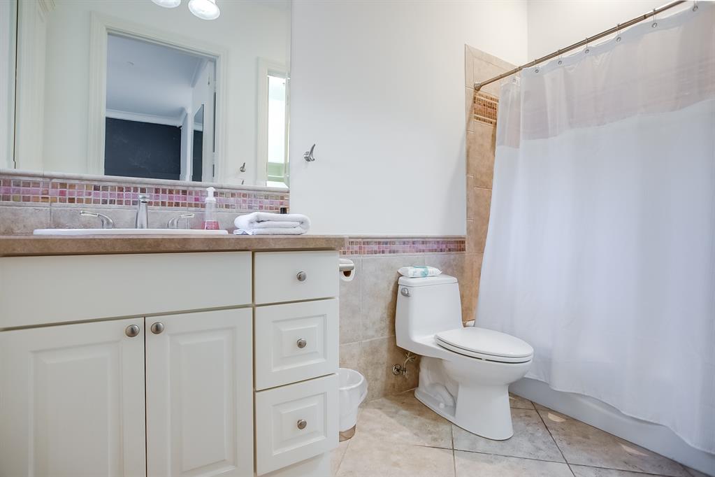 6319 Turner Way Dallas, TX 75230 - Photo 23 of 40 a bathroom with a sink a toilet and a mirror