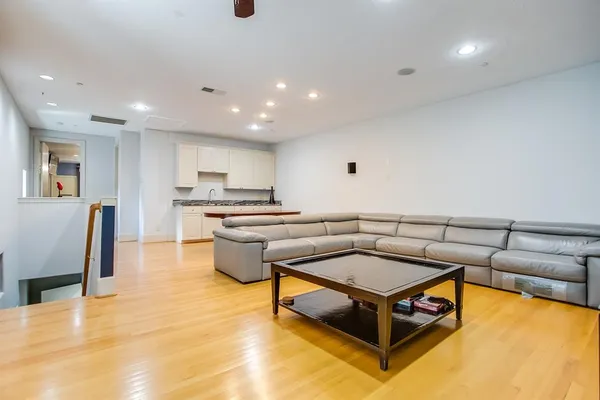a kitchen with stainless steel appliances granite countertop a sink counter space and cabinets