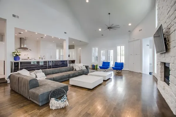 a living room with fireplace furniture and a flat screen tv