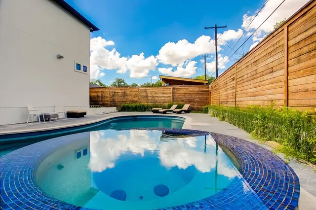 a view of swimming pool from a balcony