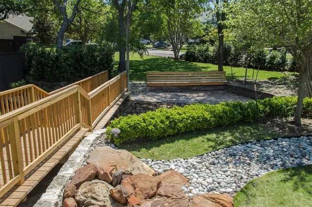 a view of a pathway with a yard