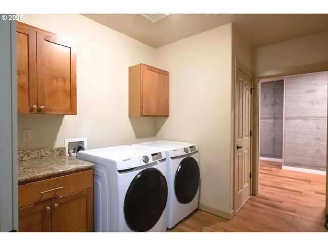 a bathroom with a shower and a glass door