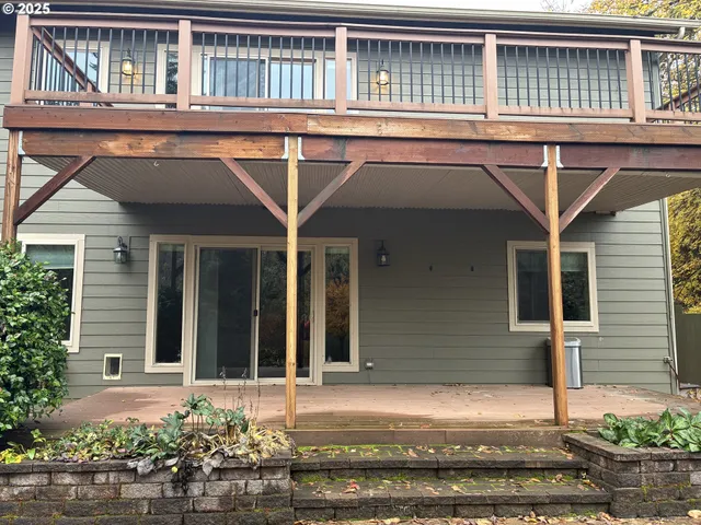 a view of a wooden deck with trees