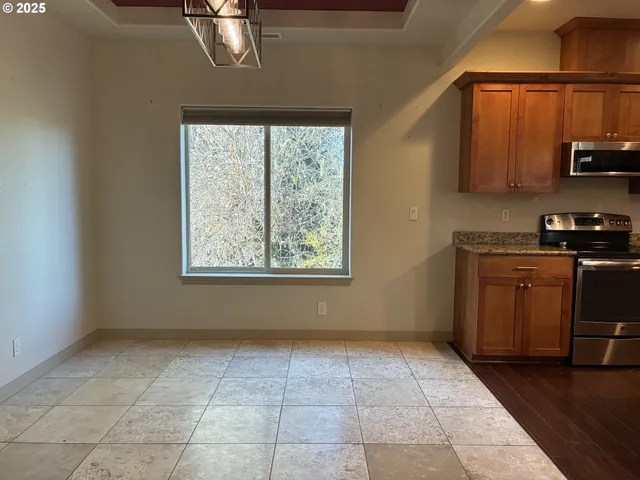 a kitchen with a refrigerator and a sink