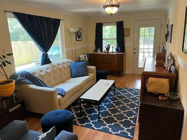 a kitchen with stainless steel appliances granite countertop a sink refrigerator stove and microwave