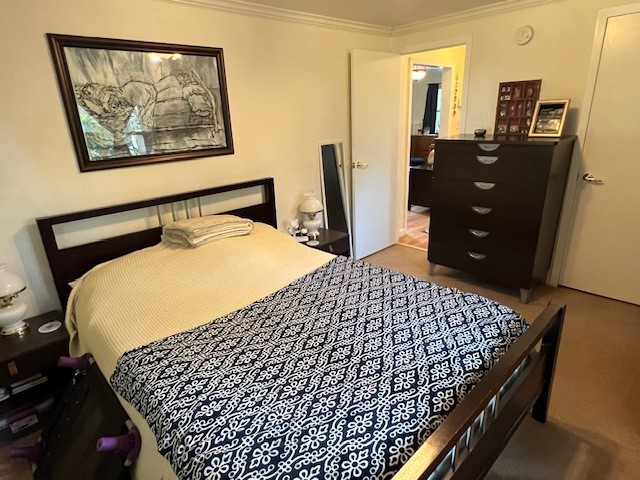 1505 Maple Street Georgetown, TX 78626 - Photo 10 of 20 a bedroom with bed and wooden floor