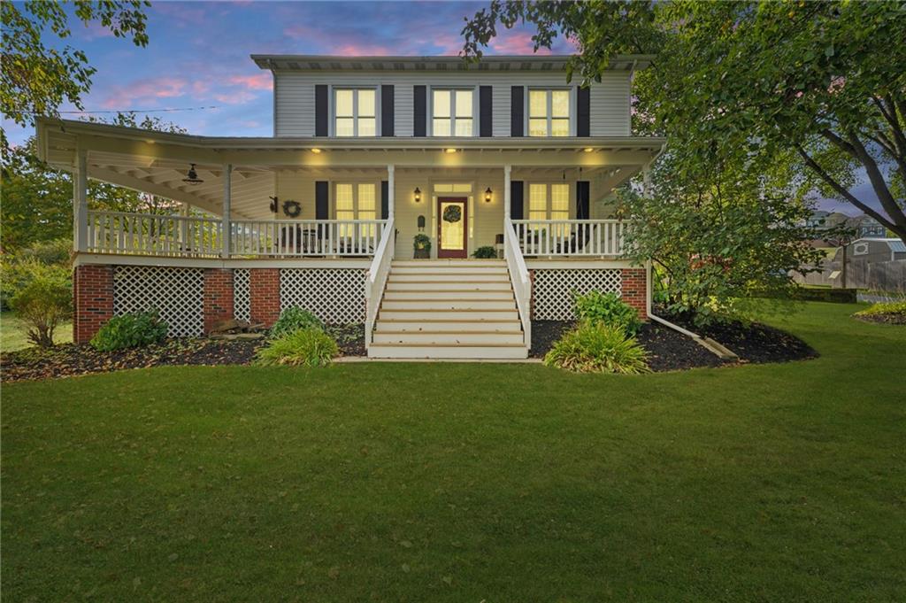 a front view of a house with a garden