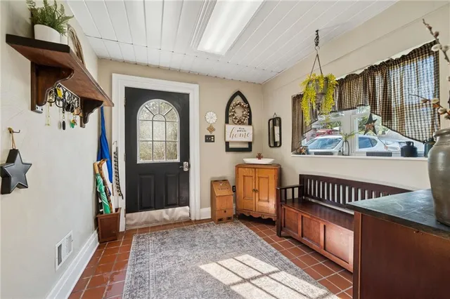 a view of a livingroom with furniture and a window