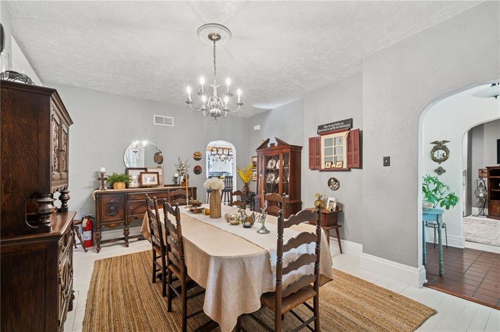 1200 Hahntown-Wendel Road Irwin, PA 15642 - Photo 21 of 49 a view of a dining room with furniture a chandelier and wooden floor