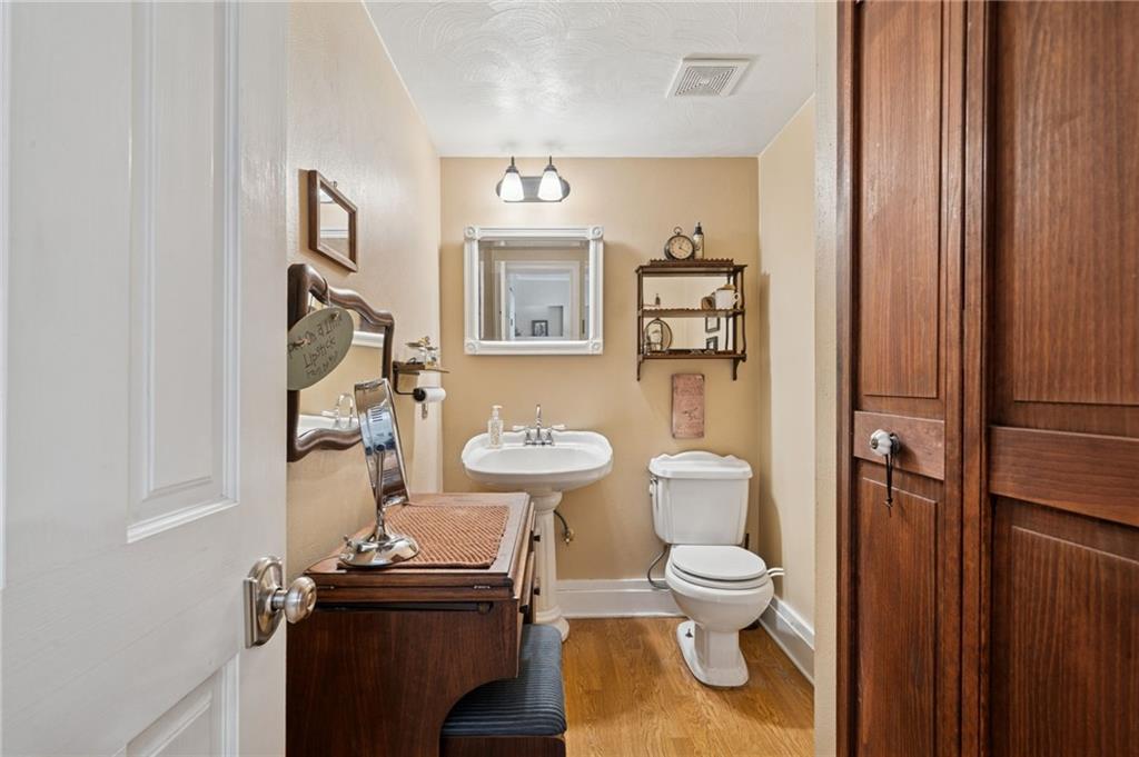 1200 Hahntown-Wendel Road Irwin, PA 15642 - Photo 23 of 49 a bathroom with a toilet a sink and mirror