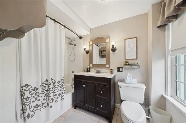 a bed room with a bed and a mirror