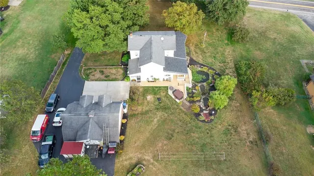 an aerial view of residential houses with outdoor space