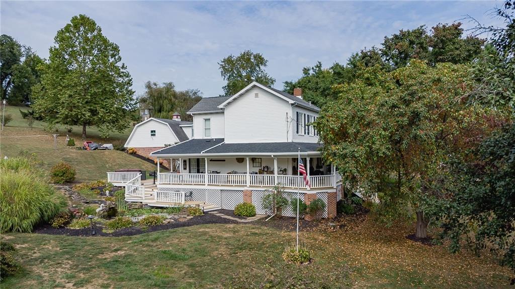 1200 Hahntown-Wendel Road Irwin, PA 15642 - Photo 3 of 49 an aerial view of a house with a yard and balcony